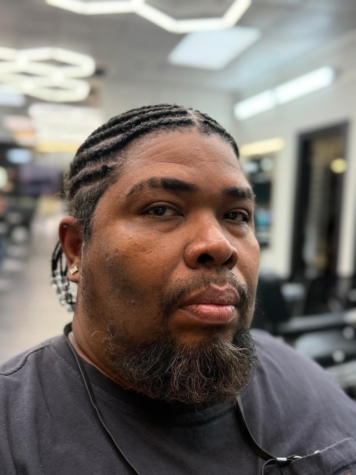 El Chino — barber at The Dominicans Barbershop