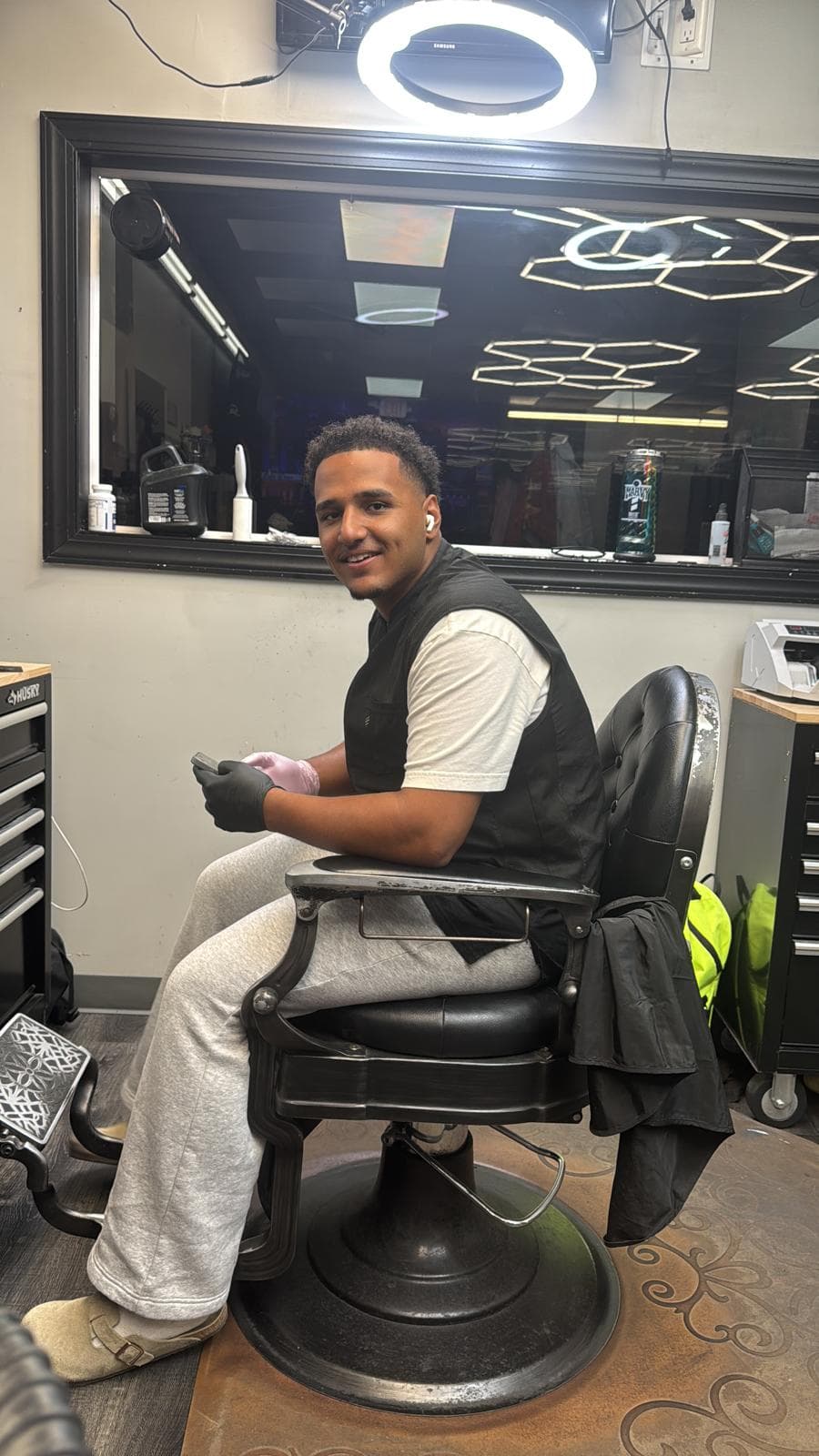 Henny — barber at The Dominicans Barbershop